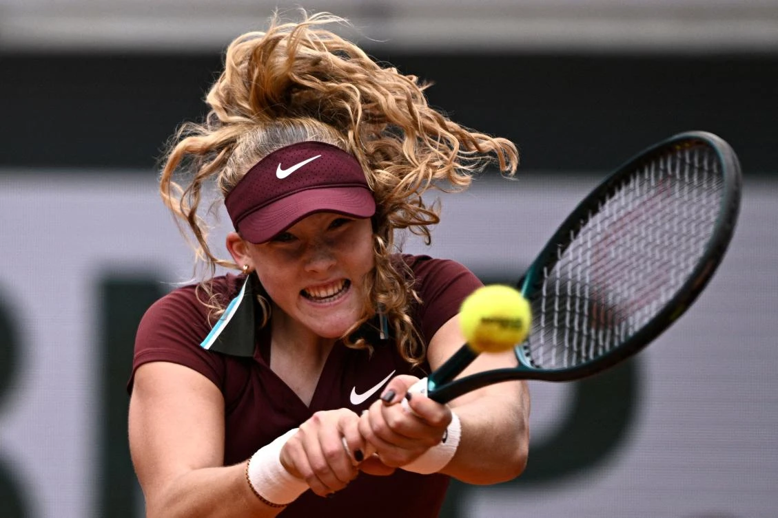 Russia's Mirra Andreeva plays a backhand return to Spain's Cristina Bucsa during their women's singles match on day 3 of the French Open tennis tournament on Court Suzanne-Lenglen at the Roland-Garros Complex in Paris on May 27, 2025. (AFP)