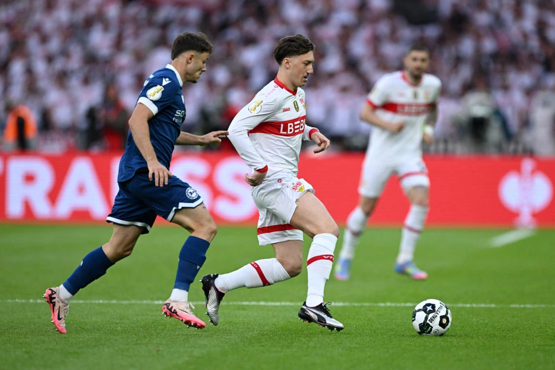 VfB Stuttgart’s Angelo Stiller in action with Arminia Bielefeld’s Felix Hagmann during their DFB Cup — Final at Olympiastadion, Berlin, May 24, 2025. (Reuters)