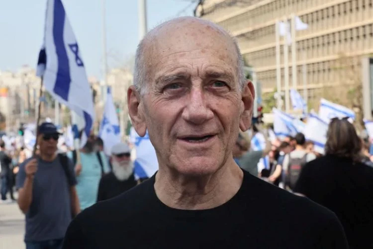 Former Israeli Prime Minister Ehud Olmert, seen here at a March 2023 demonstration in Tel Aviv, wrote an op-ed condemning his country for committing ‘war crimes’ in Gaza. (Getty Images)