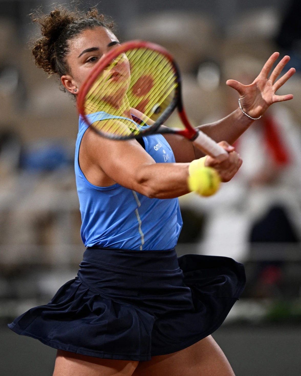 Italy’s Jasmine Paolini plays a forehand return to Australia’s Ajla Tomljanovic during their women’s singles match on day 4 of the French Open on Court Philippe-Chatrier Wednesday at the Roland Garros Complex in Paris. (AFP)