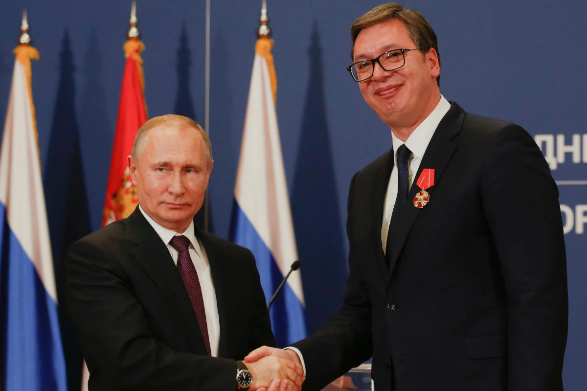 Russian President Vladimir Putin, left, shakes hands with Serbian President Aleksandar Vucic after being awarded the Order of Alexander Nevsky in Belgrade, Serbia, on Jan. 17, 2019. (AP Photo/File)