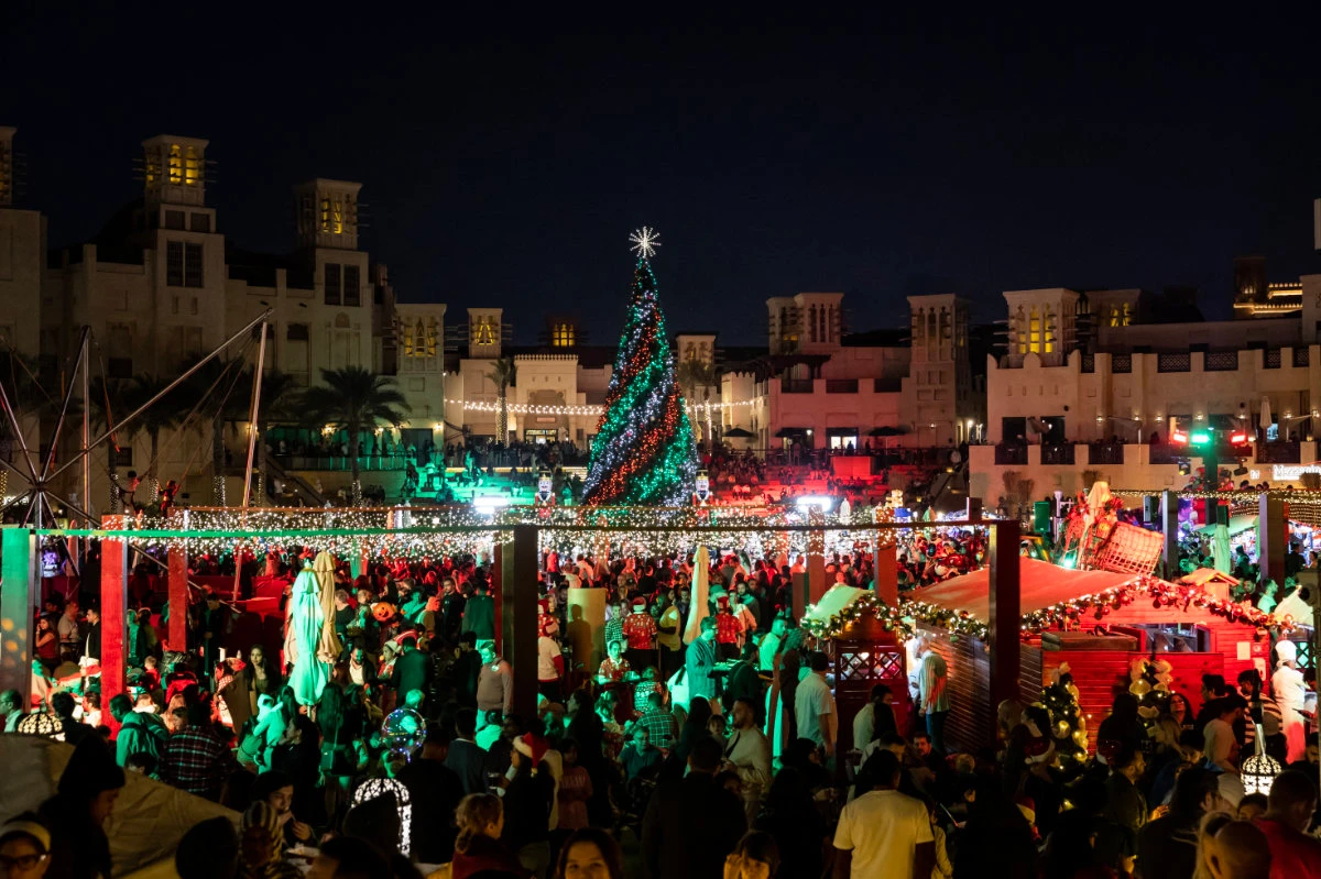 People visit a Christmas market in Souk Madinat Jumeirah in Dubai on Dec. 22, 2024. (AFP)