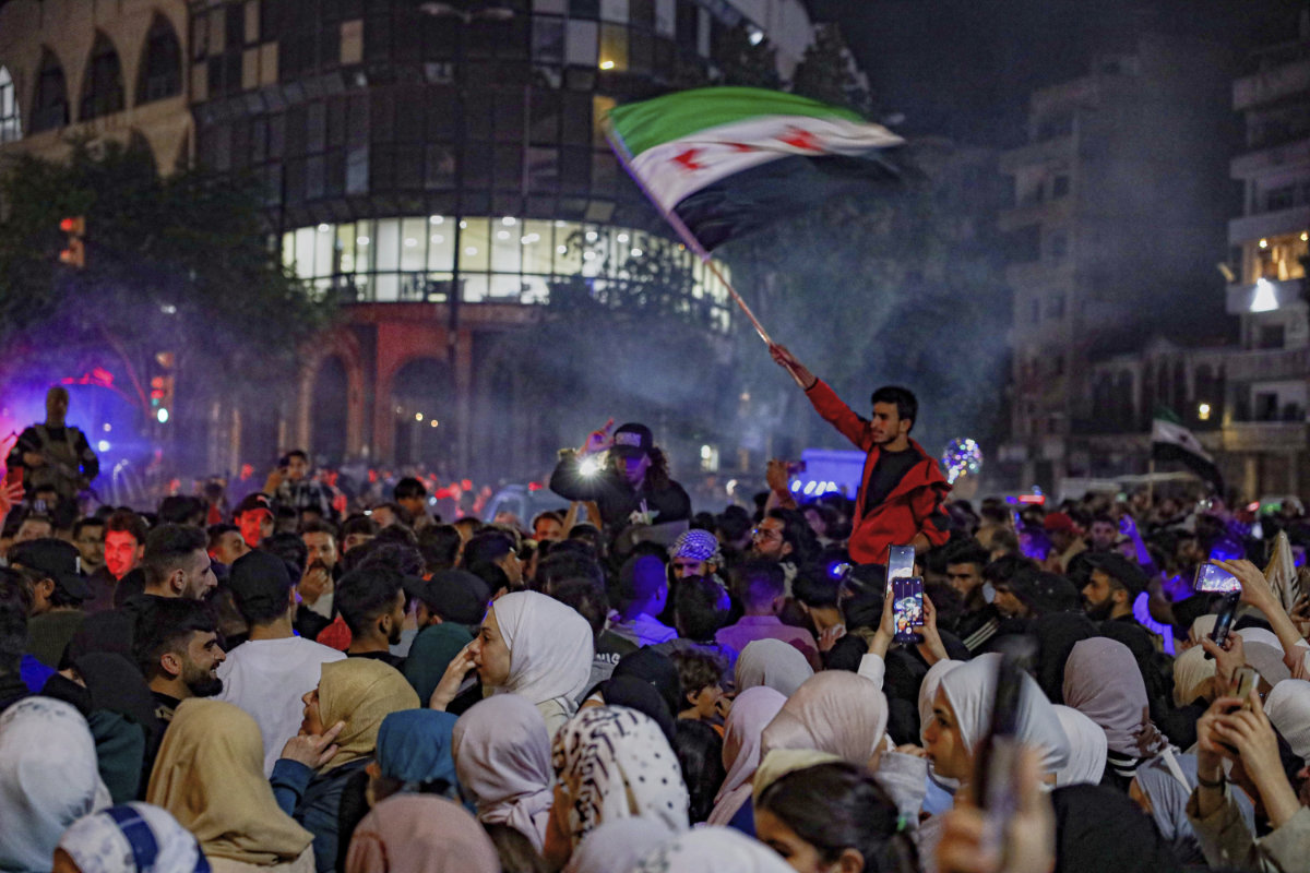 People celebrate in Damascus on May 13, 2025 after hearing the news that President Trump was easing US sanctions on Syria. (AP)