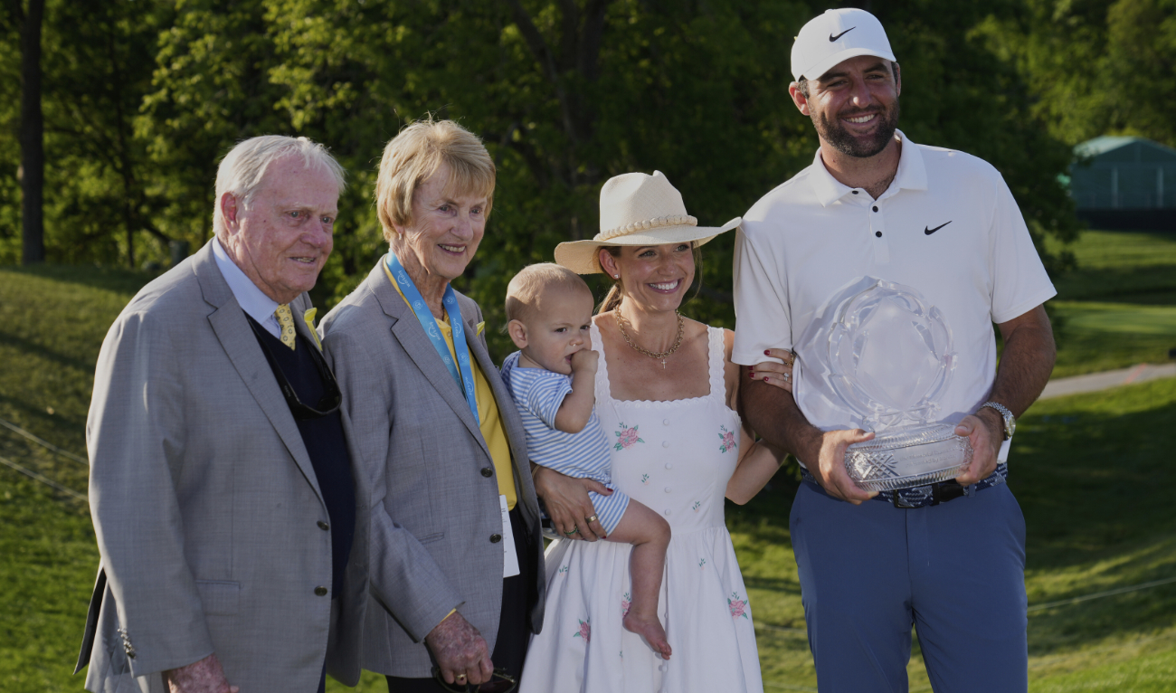 Scottie Scheffler, right, holds the trophy as he poses for a photo with his wife Meredith, second from right, and son Bennett, center, and Jack, left, and Barbara Nicklaus, second from left, after winning the Memorial golf tournament Sunday in Dublin, Ohio. (AP)