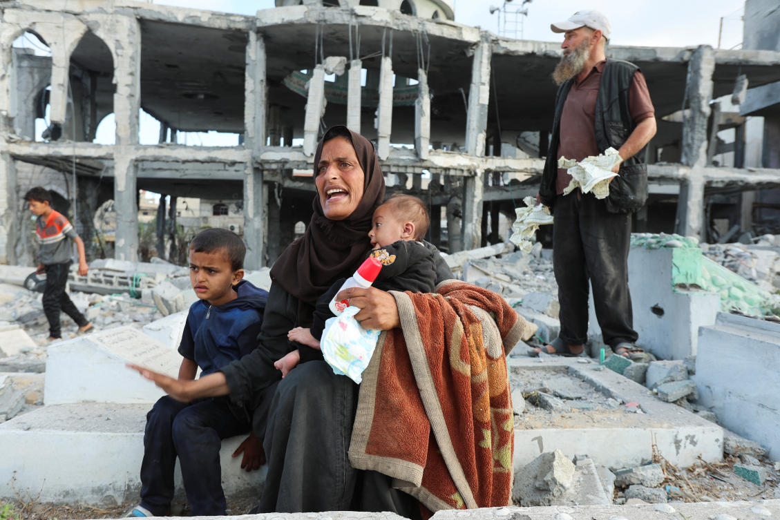 Palestinians react at the site of an Israeli strike on a mosque, in Deir Al-Balah, in the central Gaza Strip, June 2, 2025. (Reuters)