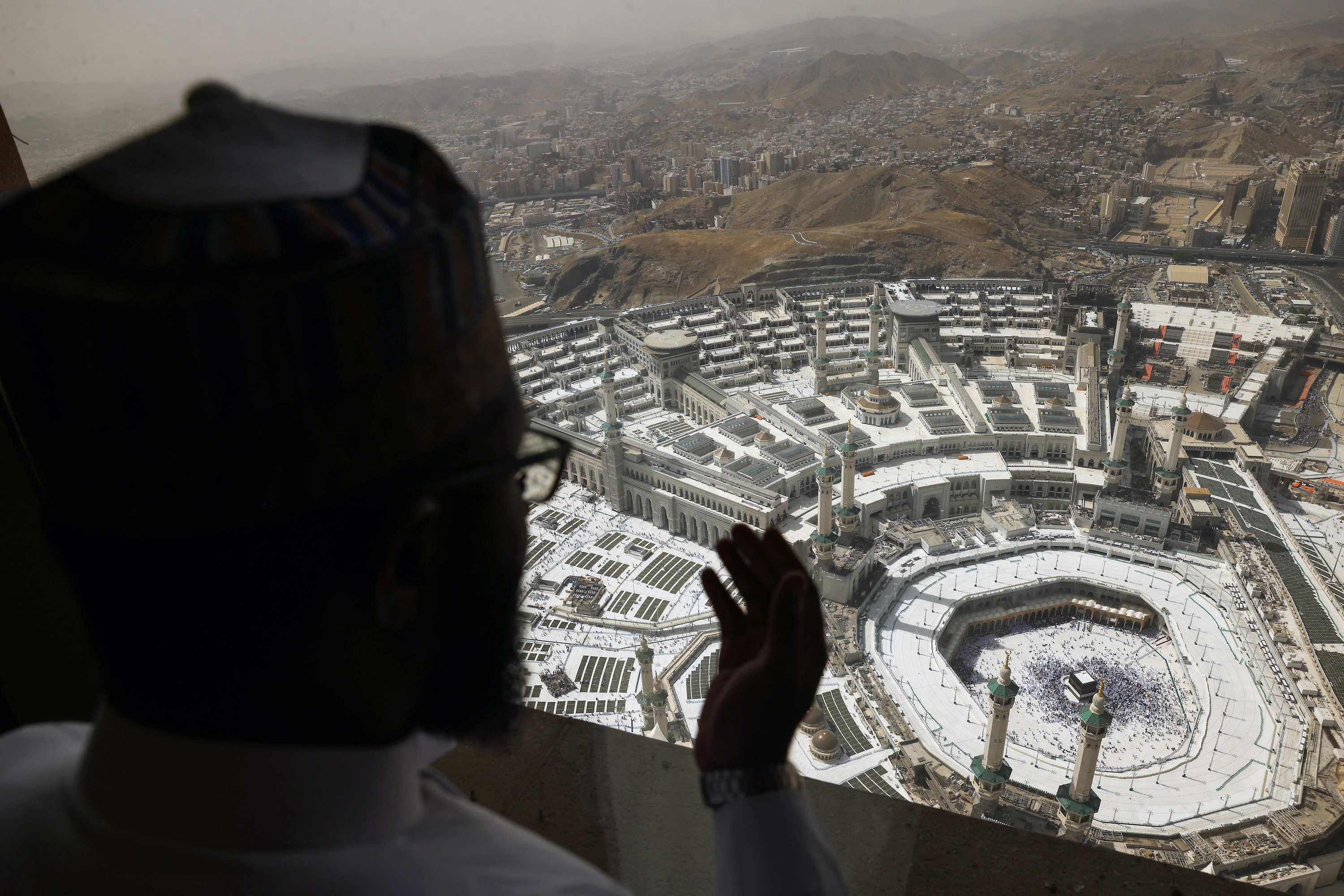 A Muslim pilgrim prays overlooking the Kaaba at the Grand Mosque complex in the holy city of Makkah before the annual Hajj pilgrimage, June 2, 2025. (AFP)