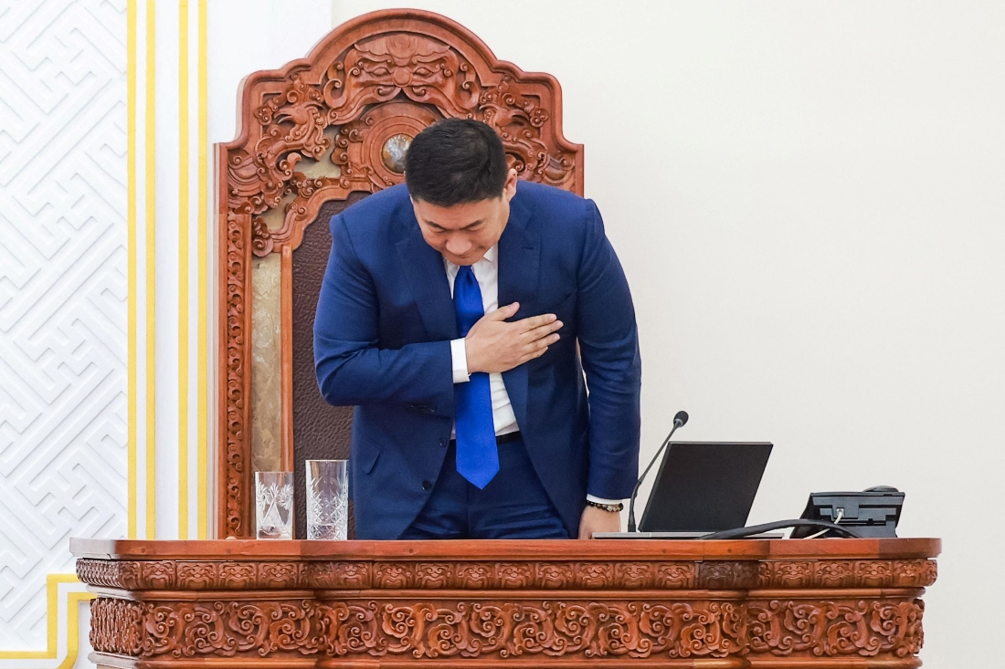 Mongolia's Prime Minister Luvsannamsrain Oyun-Erdene takes a bow after losing his position in a vote in Ulaanbaatar, Mongolia. (AFP)