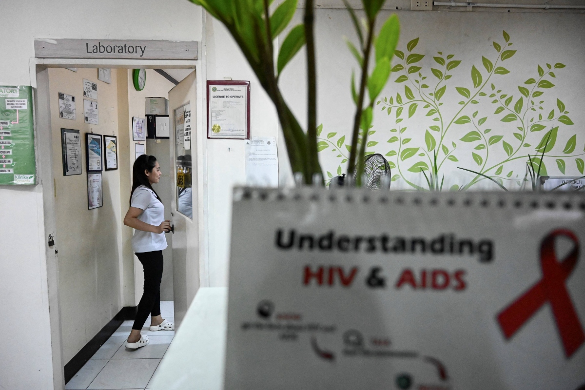 A staff enters a laboratory at a social hygiene clinic in Quezon City, Metro Manila on May 10, 2023. (AFP)