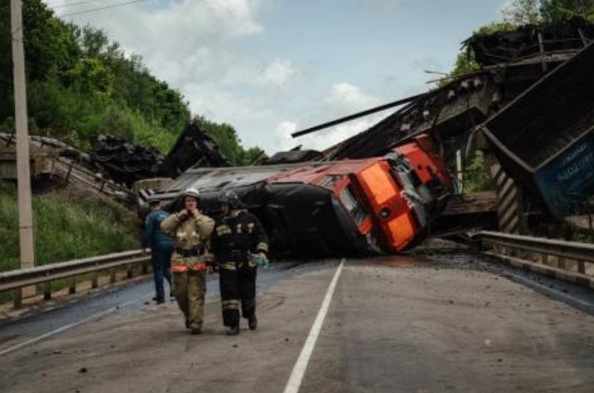 This handout photograph posted on the Telegram account of Kursk region acting governor Alexander Khinshtein on Jun. 1, 2025 shows a damaged freight train at the site of a railway bridge collapse in the Kursk region. (AFP)