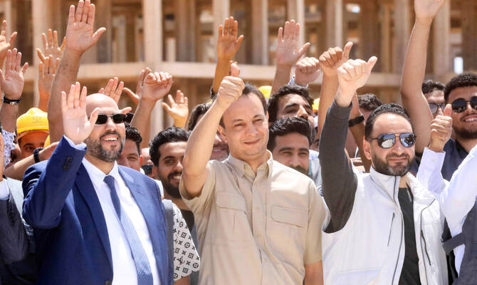 Belgasem Haftar (center) is in charge of eastern Libya’s reconstruction fund. (AFP/File)