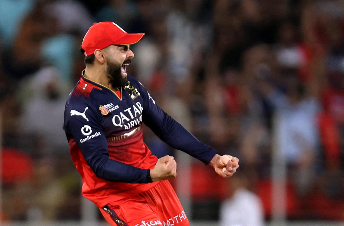 Royal Challengers Bengaluru’s Virat Kohli celebrates the wicket of Punjab Kings’ Shreyas Iyer on the way to IPL title victory. (Reuters)