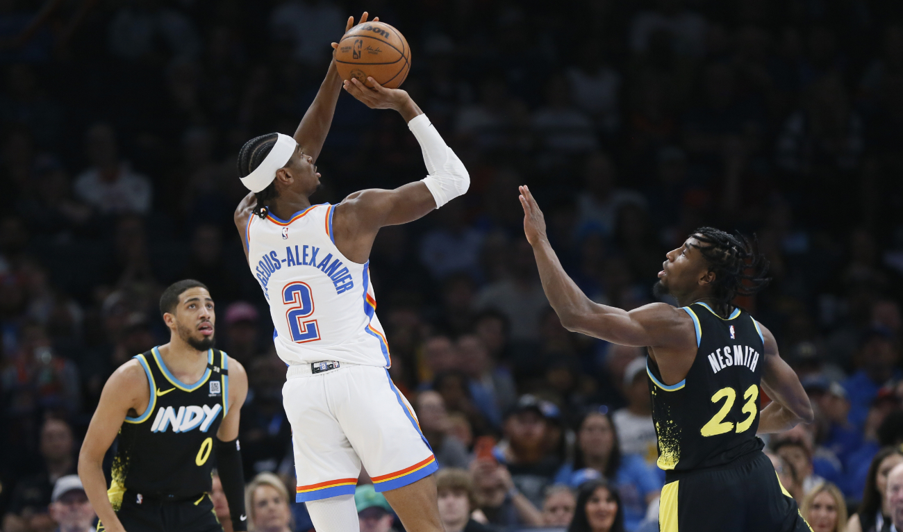 Oklahoma City Thunder guard Shai Gilgeous-Alexander (2) looks to shoot between Indiana Pacers guard Tyrese Haliburton (0) and forward Aaron Nesmith (23) during an NBA basketball game on March 12, 2024, in Oklahoma City. (File/AP)