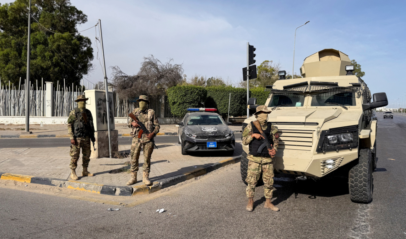 Libyan soldiers stand guard in Tripoli to maintain order. (Reuters)