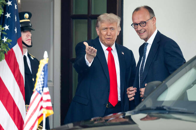 US President Donald Trump gestures toward the press as he welcomes German Chancellor Friedrich Merz to the White House in Washington on June 5, 2025. (AFP)