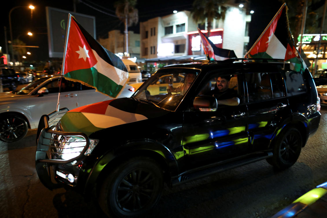 Jordanians celebrate after Jordan qualified for the World Cup for the first time, winning 3-0 over Oman, in Amman on June 5, 2025. (Reuters)