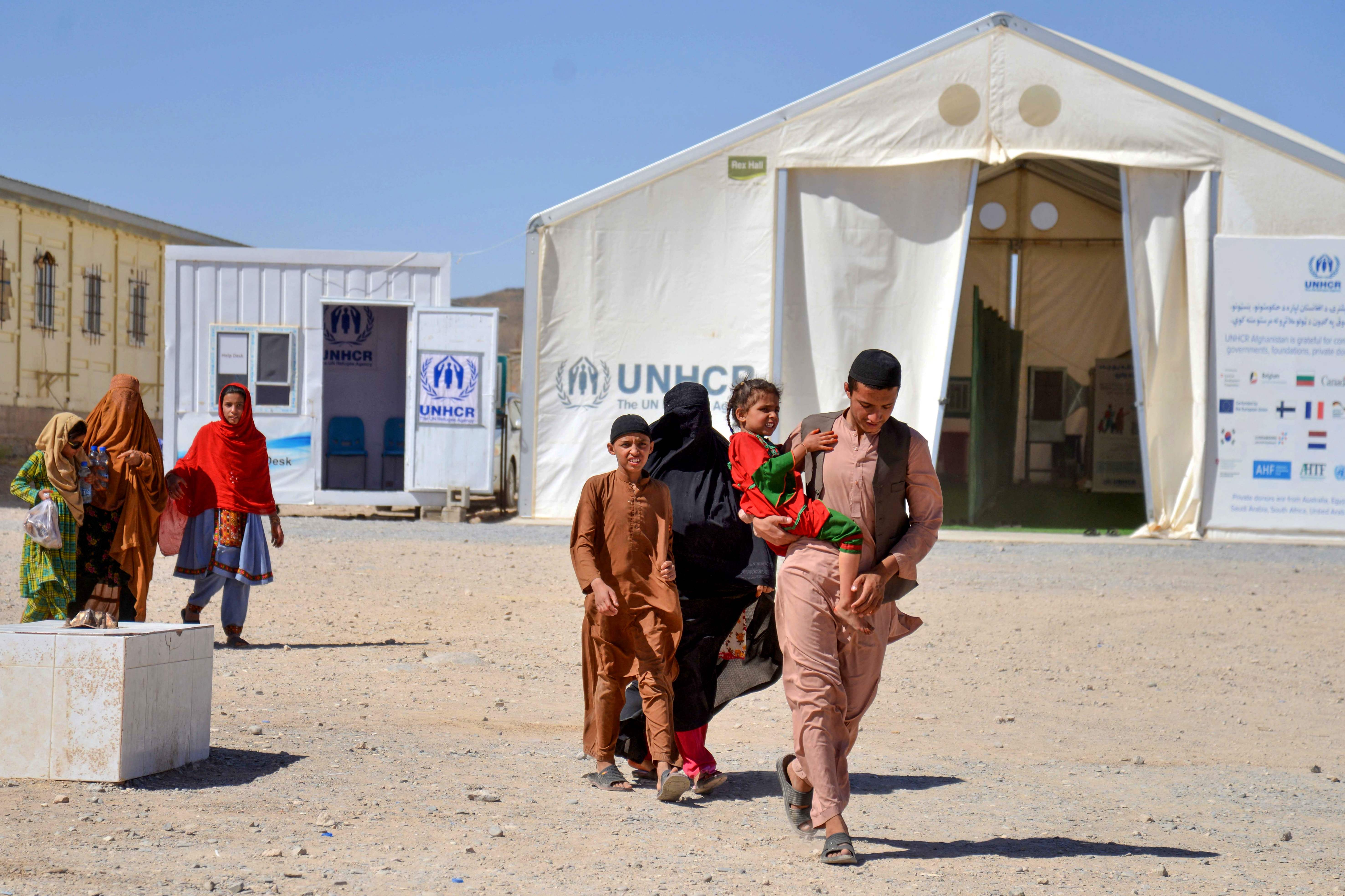 Afghans walk after their arrival from Pakistan, in Takhta Pul, Afghanistan, on June 4, 2025. (AFP)