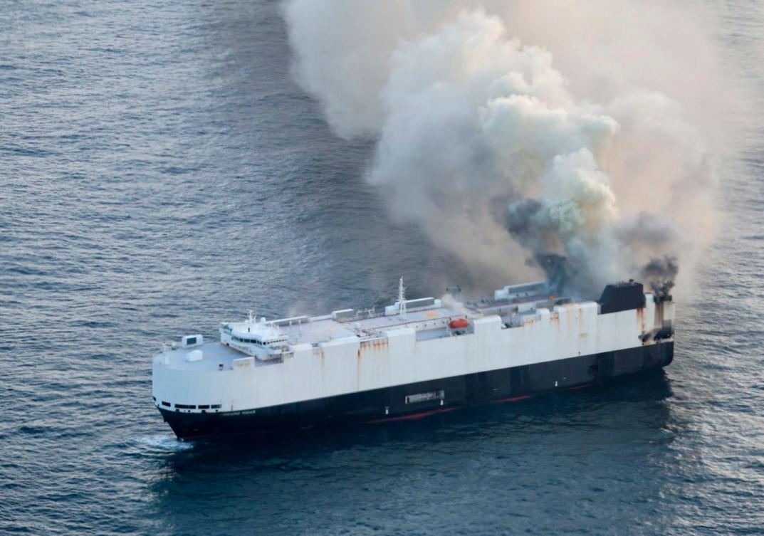 Smoke rises from cargo vessel Morning Midas approximately 300 miles south of Adak, Alaska, June 3, 2025, as the crew abandoned ship after they could not control a fire in the ship. (US Coast Guard/Courtesy Air Station Kodiak via AP)