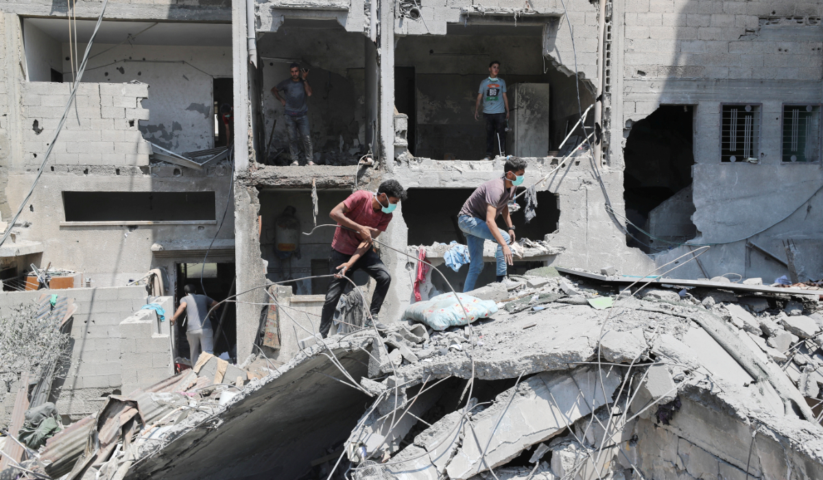 Palestinians inspect the damage at the site of an Israeli strike on a house, in Gaza City, June 7, 2025. (REUTERS)