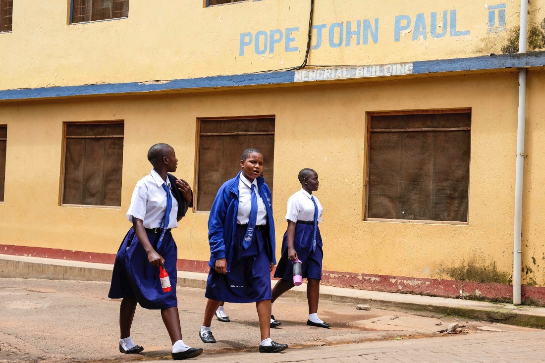 School girls walk around Uganda Martyrs' Secondary School Namugongo, in Kampala, Uganda. (AP)