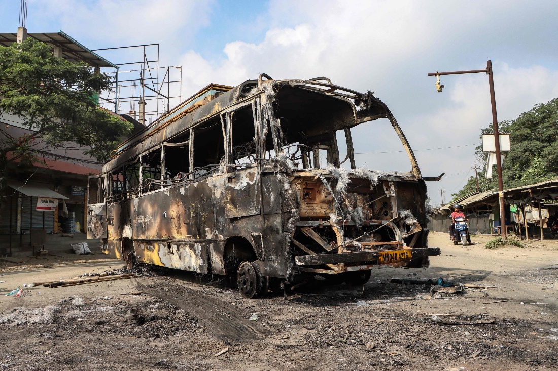 A pictured burned out bus after violence broke out in the streets of Manipur, India. (AFP)