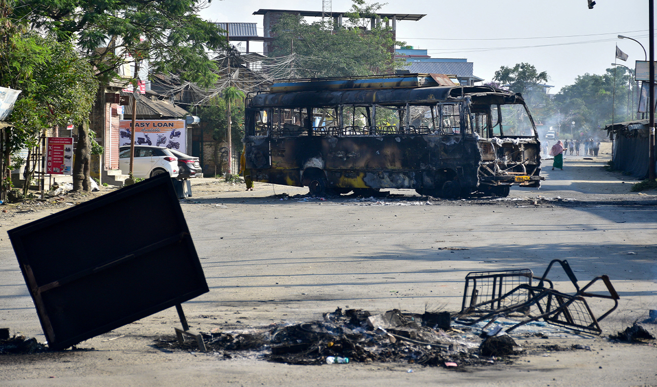 A bus burned by a mob is parked in a street, after the arrest of an Arambai Tenggol leader by the Central Bureau of Investigation (CBI), in Imphal, Manipur, on June 8, 2025. (REUTERS)