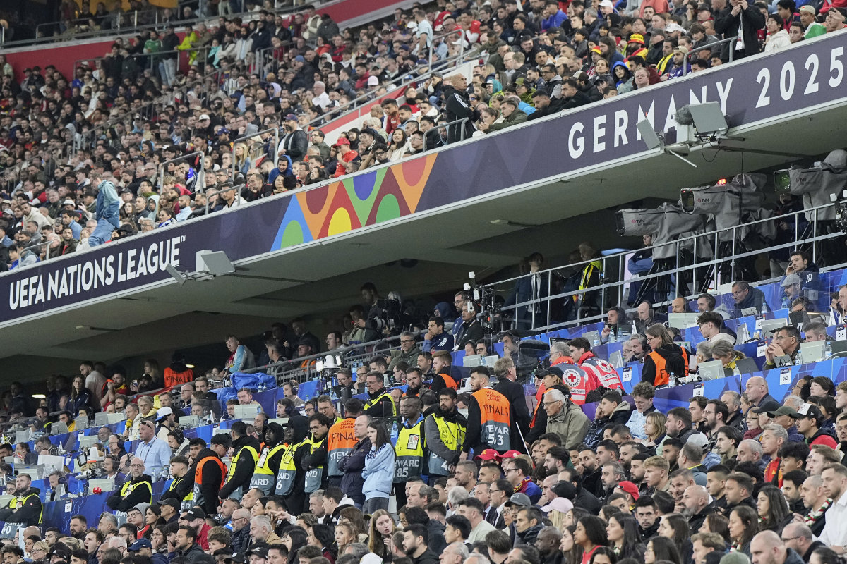 Stewards secure the media tribune after a soccer fan died after falling from an overhead level onto a media area below during the Nations League Final soccer match between Spain and Portugal in Munich, Germany, on June 8, 2025. (AP Photo)
