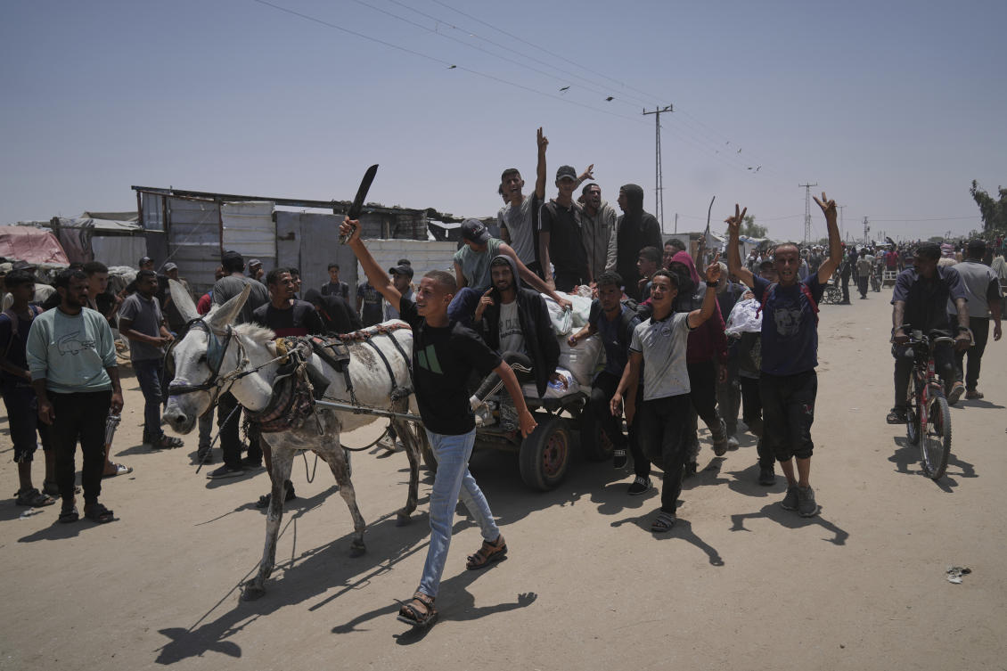 Palestinian health officials and witnesses say Israeli fire killed at least 12 people as they headed toward two aid distribution points in Gaza. (AP)