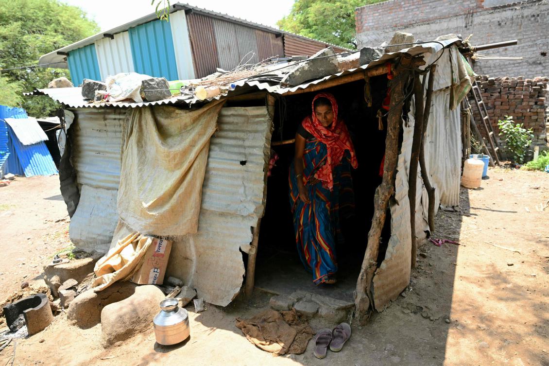 On a small farm in India’s Maharashtra state, Mirabai Khindkar said the only thing her land grew was debt, after crops failed in drought and her husband killed himself. (AFP)