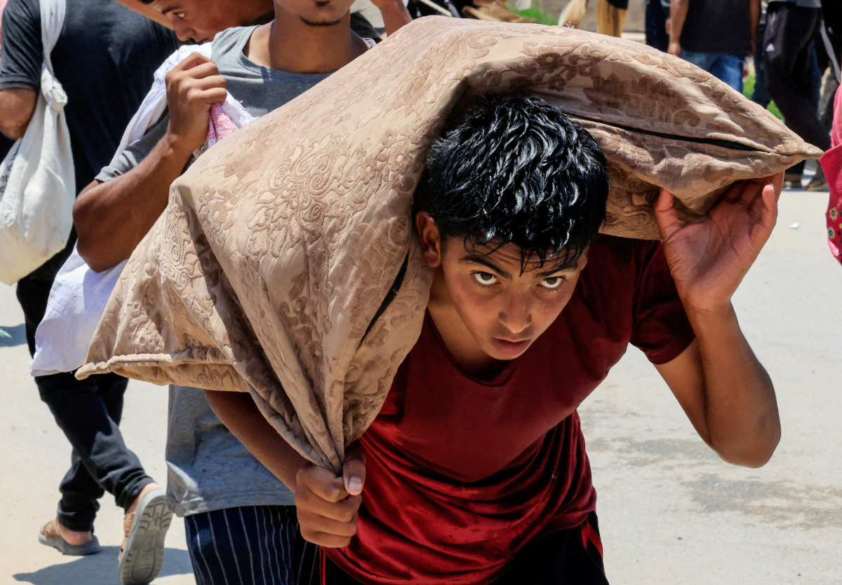 A Palestinian collects aid supplies from the U.S.-backed Gaza Humanitarian Foundation, in Rafah, in the southern Gaza Strip, June 9, 2025. (REUTERS)