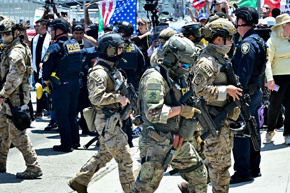 President Donald Trump ordered the deployment of 4,100 National Guard troops and 700 Marines despite strident opposition. (AFP)