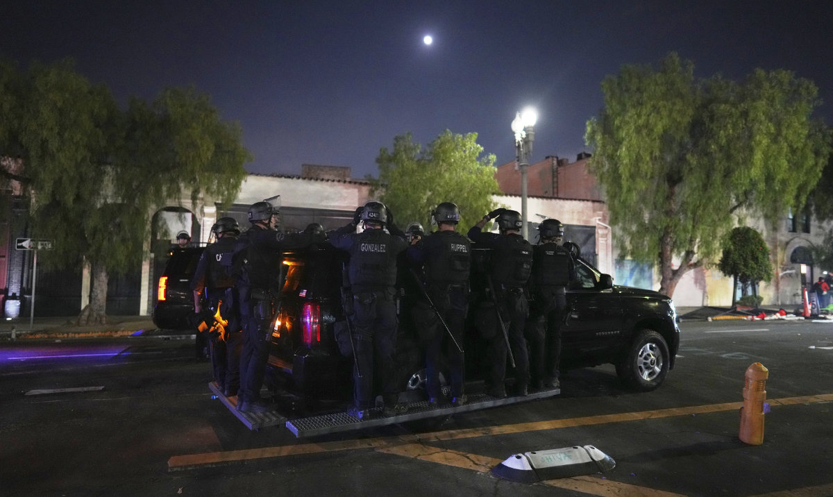 Los Angeles Police officers patrol near the metropolitan detention center of downtown Los Angeles. (AP)