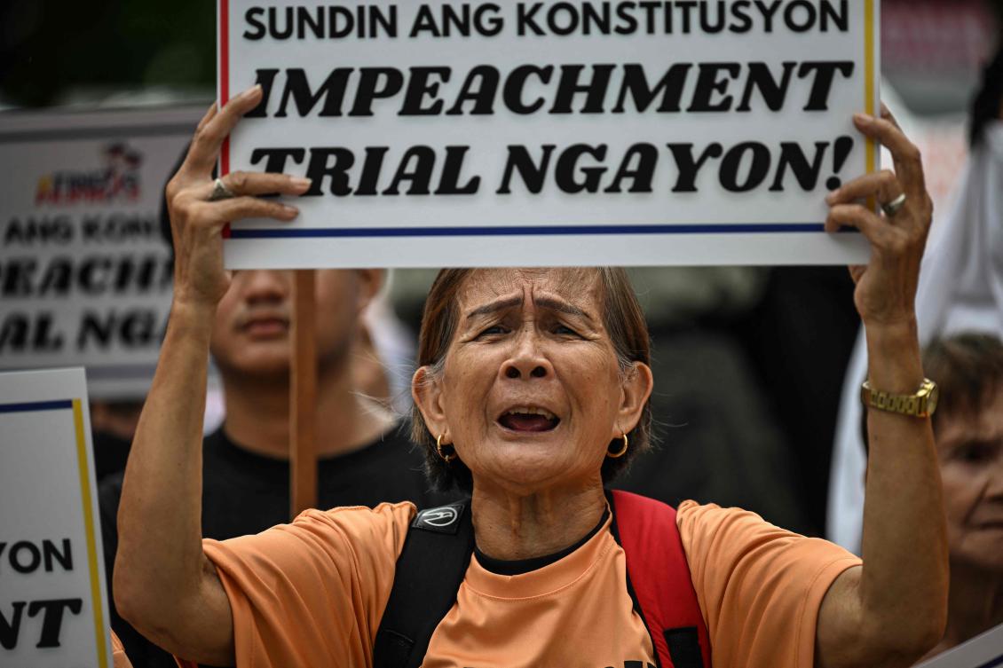 A protester following the Senate’s decision on the impeachment trial of Philippine Vice President Sara Duterte, outside the Senate of the Philippines in Pasay, Metro Manila on June 11, 2025. (AFP)