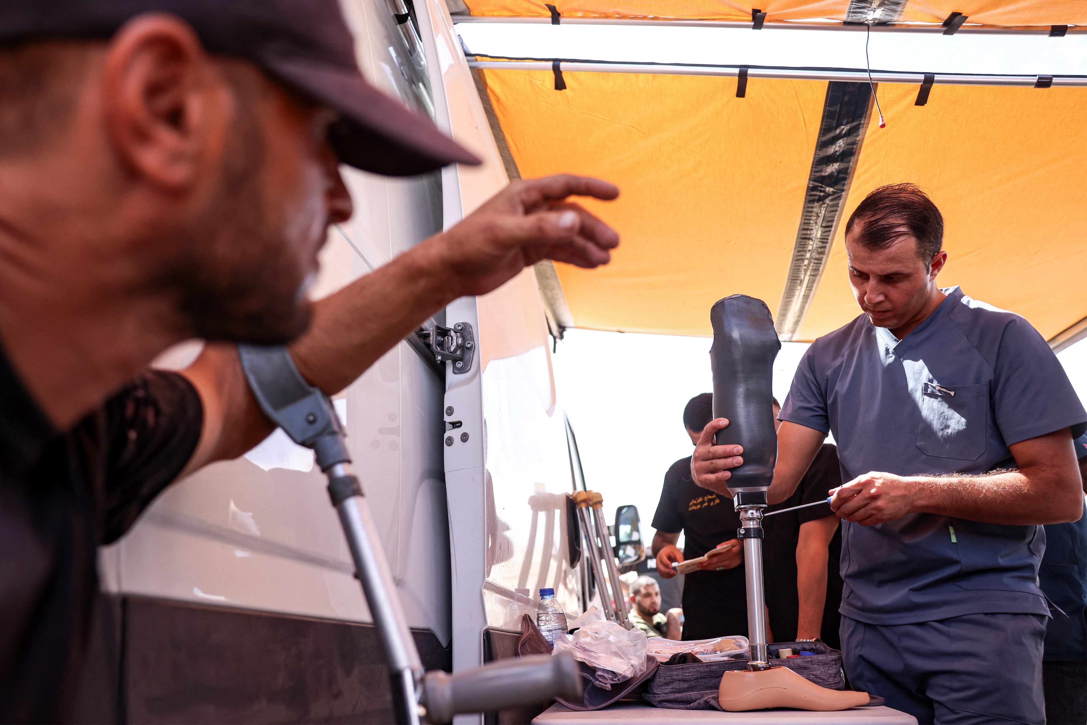An amputee looks on as a new prosthetic limb is prepared at the Jordanian field hospital in Khan Yunis in the southern Gaza Strip. (File/AFP)