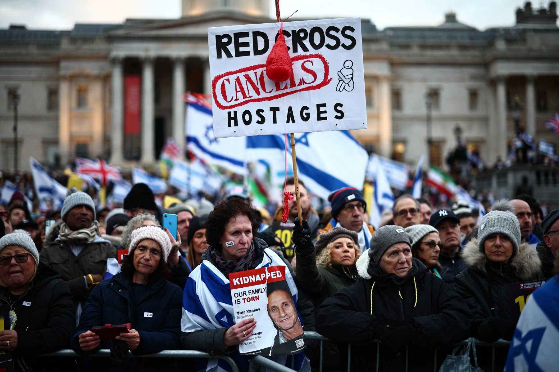 Pro-Israeli supporters, one holding a poster for Israeli hostage Yair Yaakov, as they gather for a demonstration in Trafalgar Square in central London. (File/AFP)