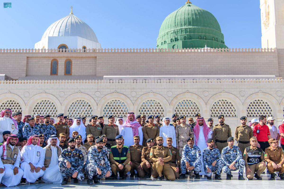 Members of the Hajj security services join a photo session outside the Prophet’s Mosque in Madinah. (SPA)