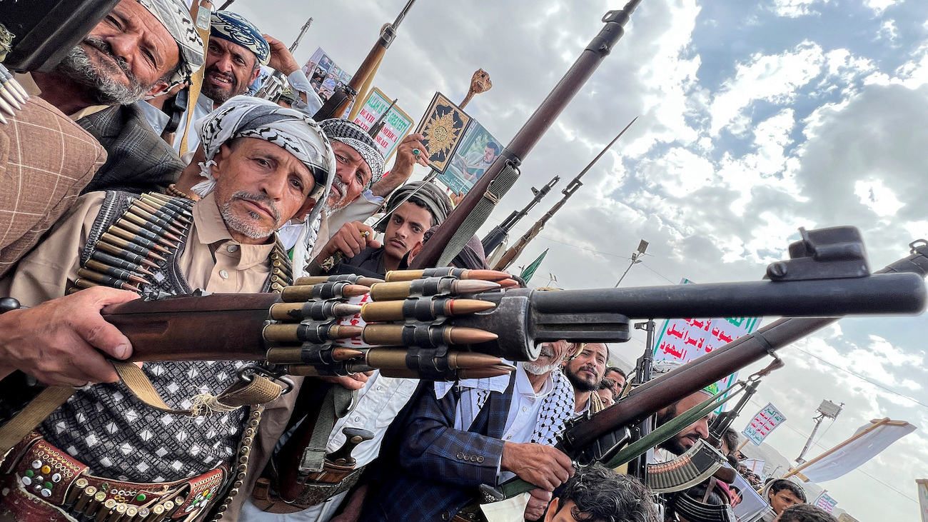 Protesters hold weapons, during a demonstration of predominantly Houthi supporters to condemn US strikes in Yemen, in Sanaa. (File/Reuters)