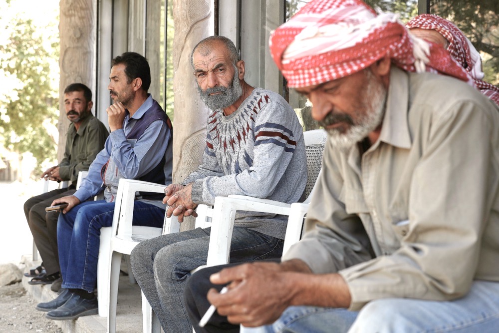 Ahmad Hammadi, center, receives condolences on the death of his son Mohammed who was killed during an Israeli pre-dawn raid on Beit Jin village, southern Syria. (AP)