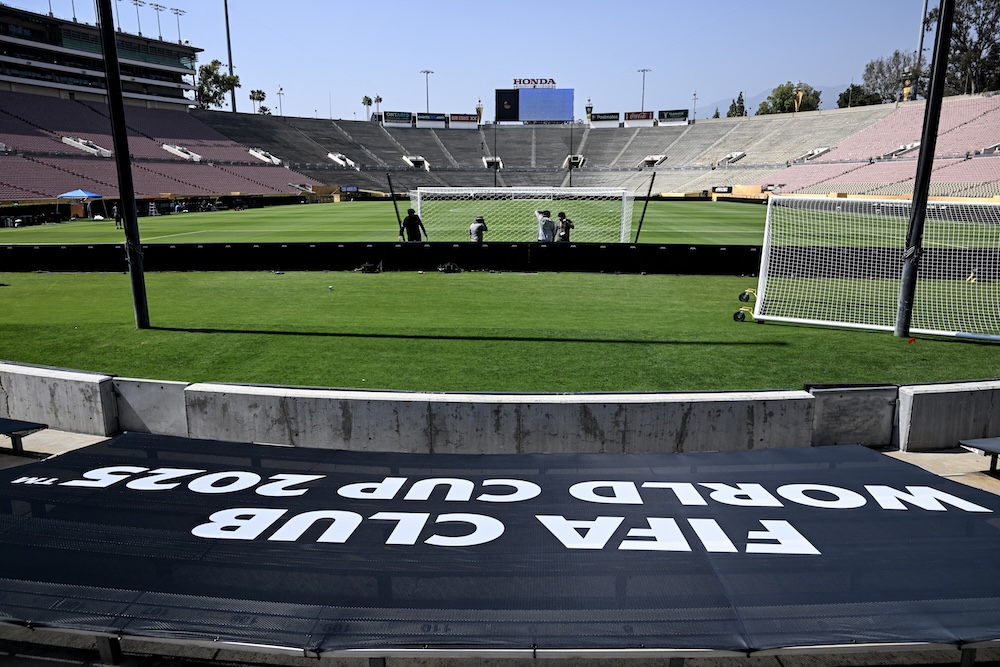 Workers install a goal at the Rose Bowl Stadium ahead of the Club World Cup 2025 football match between Paris Saint-Germain and Atletico de Madrid in Pasadena, California. (AFP)