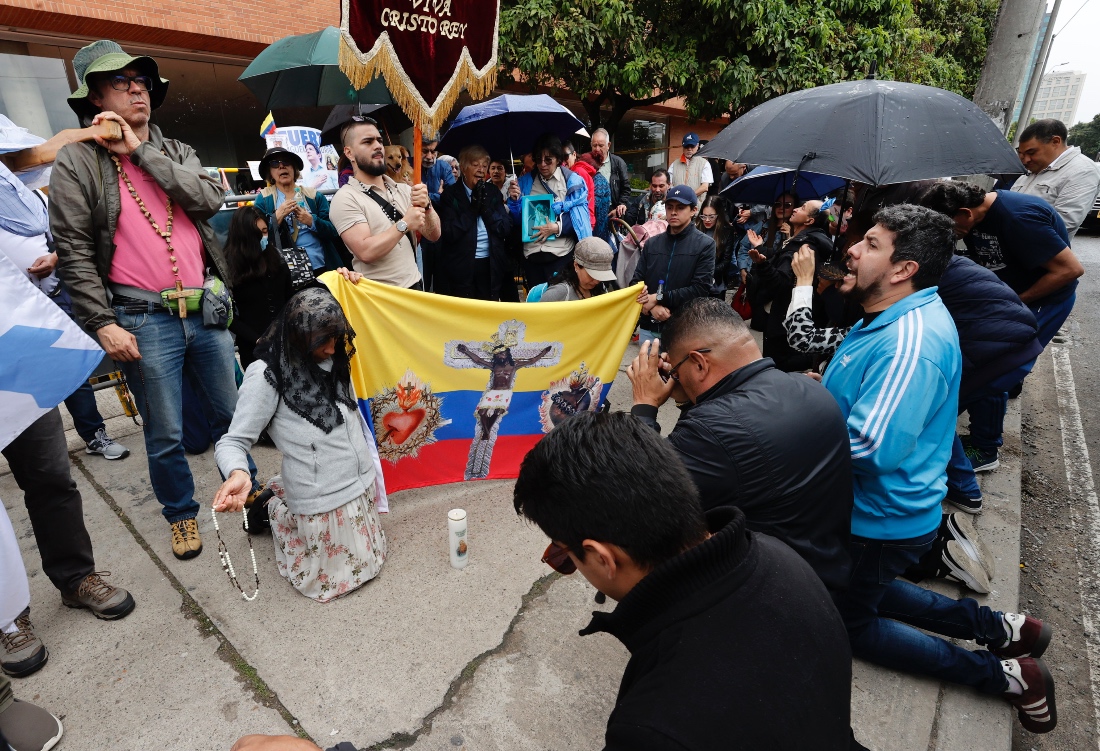 People pray the rosary in front of the Santa Fe Foundation Hospital for the recovery of Senator Miguel Uribe in Bogota, Colombia. (EPA)