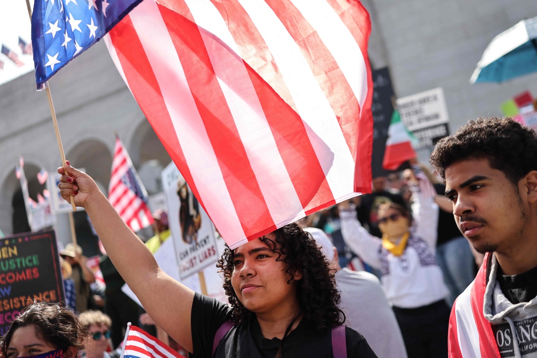 Protesters rally near City Hall during an anti-Trump "No Kings Day" demonstration in California, US. (Getty)