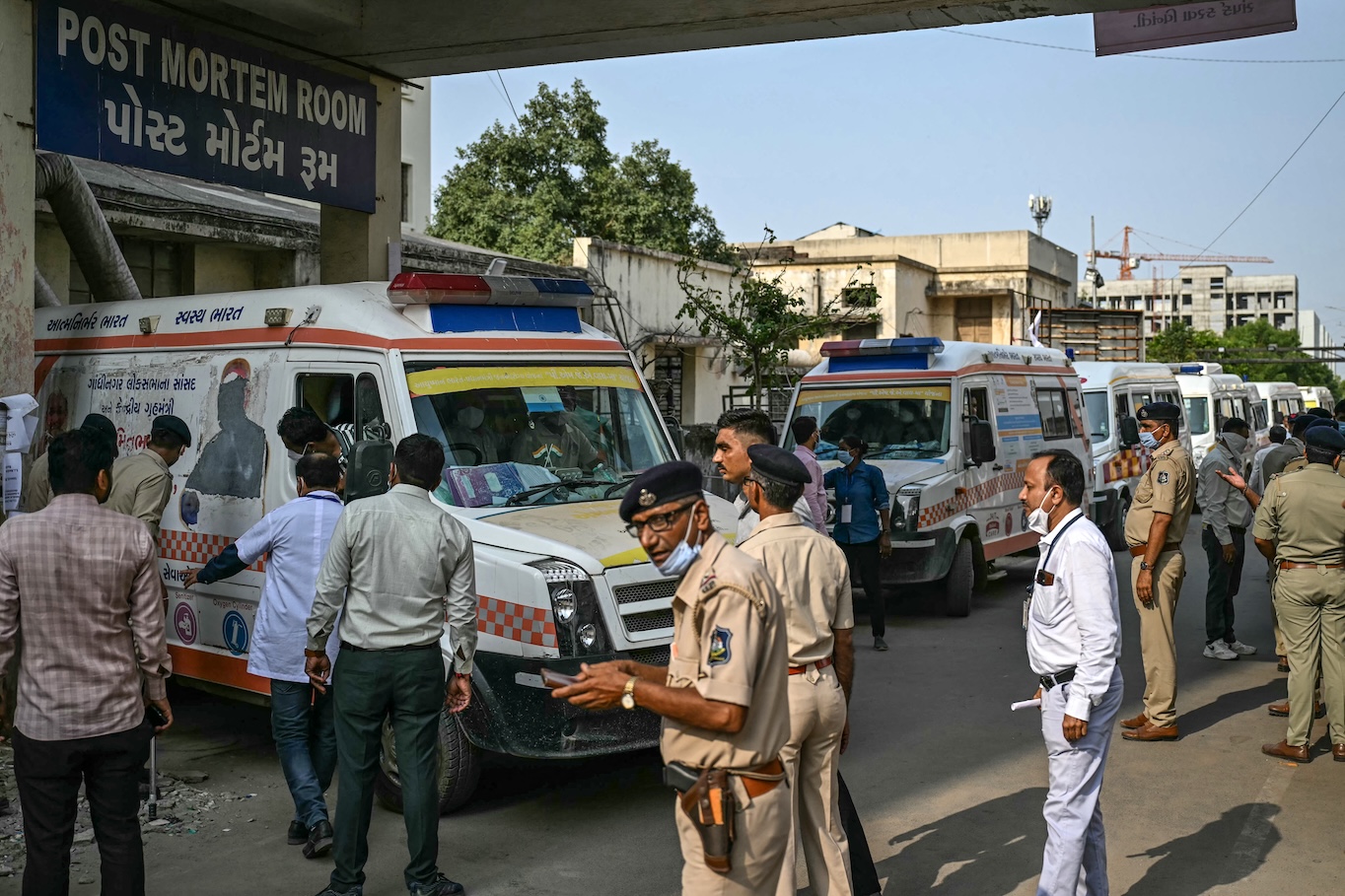 Ambulances are seen parked near a hospital in Ahmedabad on June 13, 2025, a day after an Air India flight crashed, killing all but one passenger on board. (AFP)