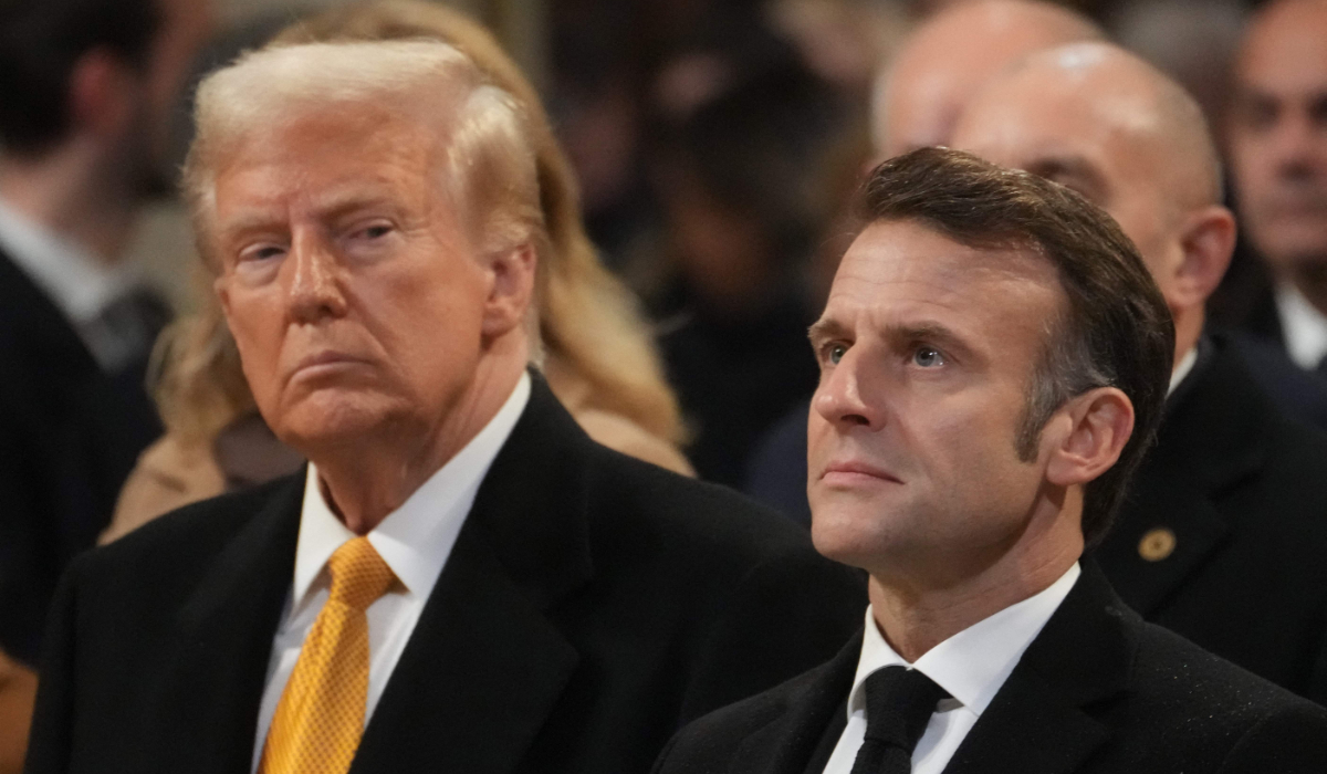 US President-elect Donald Trump (L) looks towards French President Emmanuel Macron (R) during a ceremony to mark the re-opening of the landmark Notre-Dame Cathedral in central Paris on December 7, 2024. (AFP)