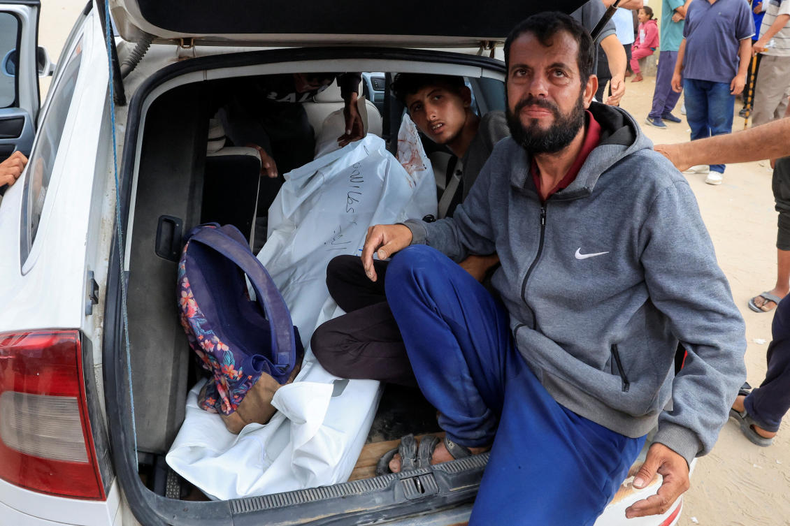 Mourners react next to a body, on the day of the funeral of Palestinians killed in what the Gaza health ministry says was Israeli fire near a distribution center in Rafah, at Nasser Hospital in Khan Younis, in the southern Gaza Strip, June 16, 2025.(REUTERS)
