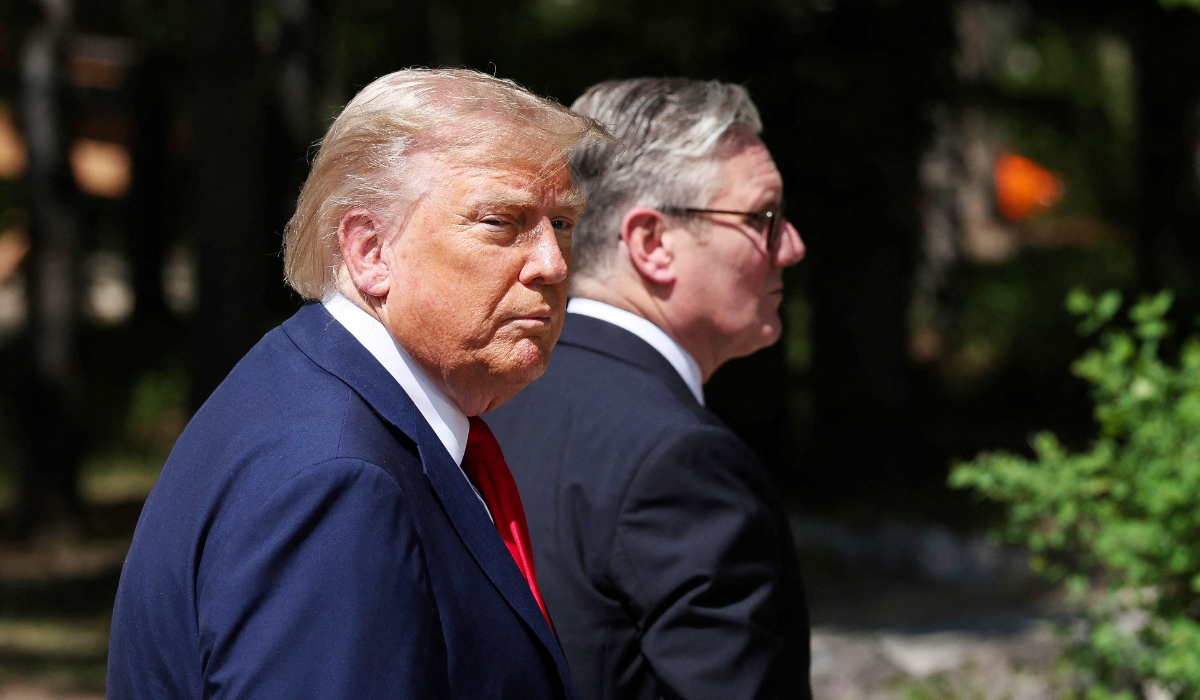 U.S. President Donald Trump, left, and Britain's Prime Minister Keir Starmer walk at the G7 summit, in Kananaskis, Alberta, Monday, June 16, 2025. (AP)