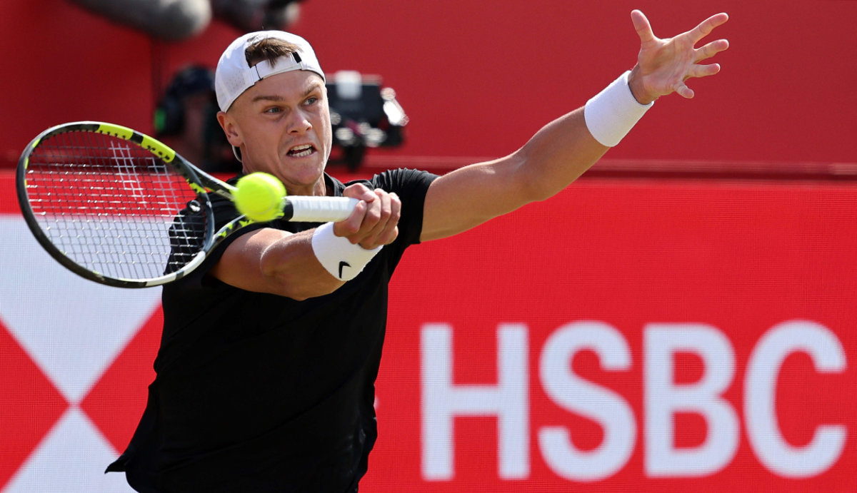 Denmark's Holger Rune returns against Australia's Christopher O'Connell during their men's singles round of 32 tennis match at the HSBC ATP tennis Championships at Queen's Club in west London on Monday. (AFP)