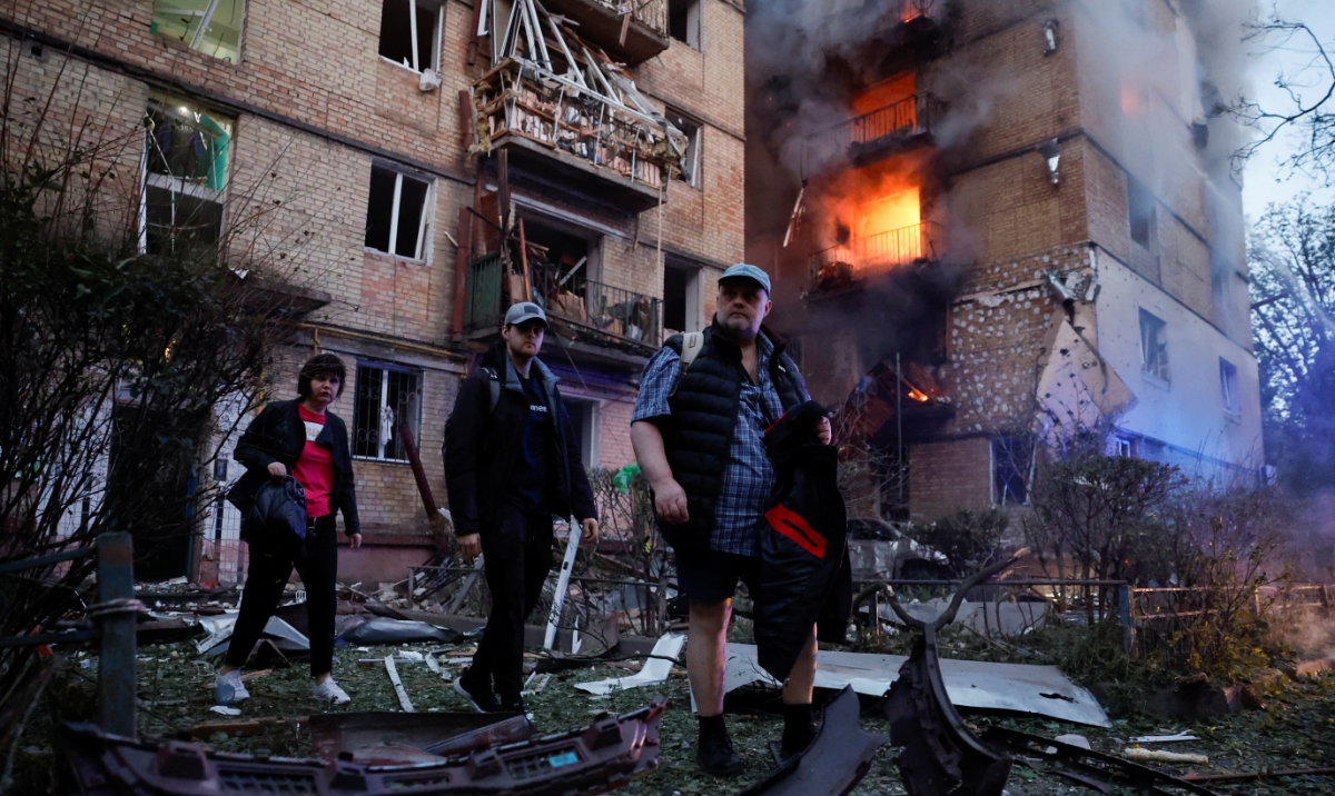 Residents leave the site of an apartment building damaged during a Russian strike, amid Russia's attack on Ukraine, in Kyiv, Ukraine June 17, 2025. (Reuters)