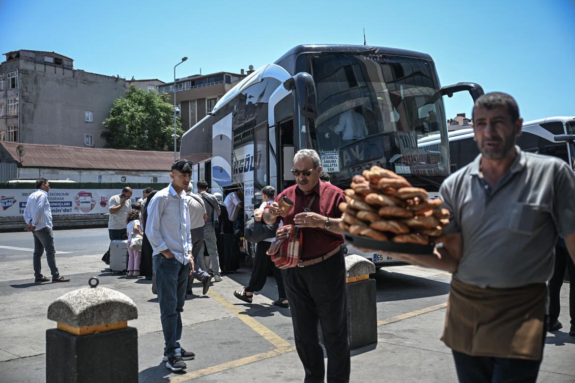 Mostly Iranian citizens board a bus traveling to Van, a city in eastern Turkiye near the border with Iran, at the Esenler bus terminal in Istanbul, on Jun. 18, 2025. (AFP)