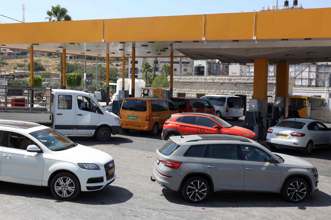 Palestinian vehicles queue outside a congested petrol station in the city of Ramallah in the occupied West Bank on June 18, 2025. (AFP)