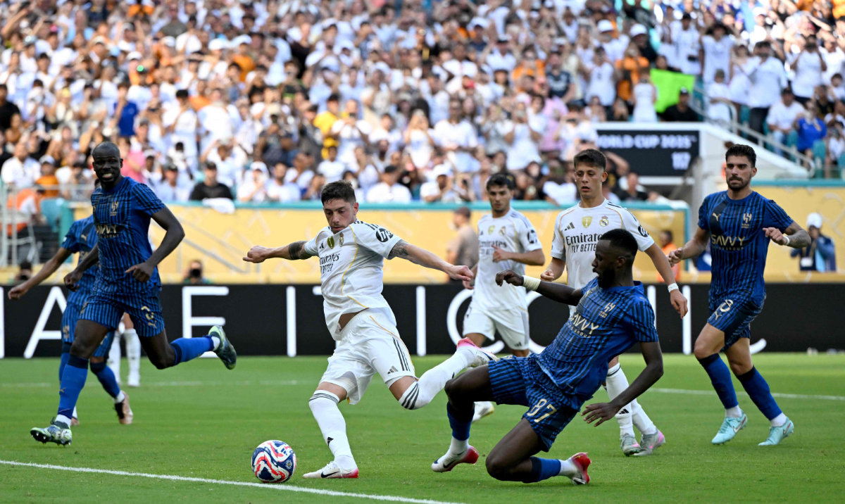 Real Madrid's Uruguayan midfielder #08 Federico Valverde and Al Hilal's Saudi defender #87 Hassan Al-Tambakti fight for the ball during the FIFA Club World Cup 2025 Group H football match between Spain's Real Madrid and Saudi's Al-Hilal at the Hard Rock stadium in Miami on June 18, 2025. (AFP)