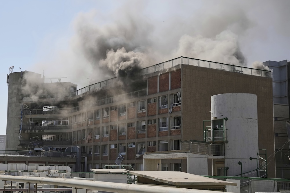 Smokes raises from a building of the Soroka hospital complex after it was hit by a missile fired from Iran in Be’er Sheva, Israel on June 19, 2025. (AP)